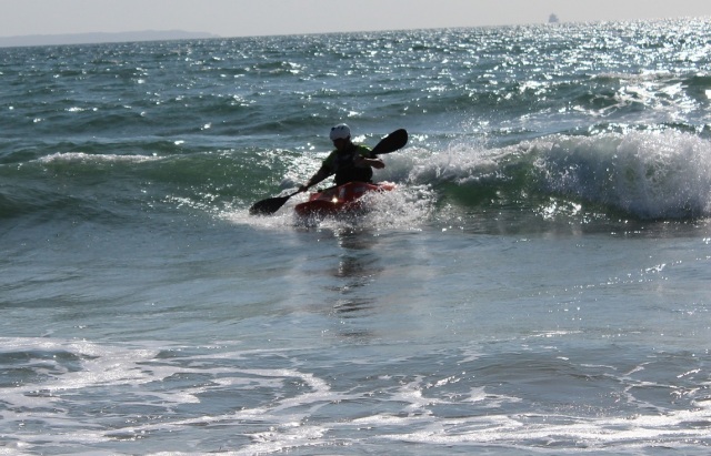 Making the most of the clean but small surf.
